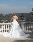 Back view of the Aurelia fitted wedding dress with two detachable train panels and a sweeping train