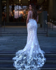 Lisette lace fit-and-flare wedding dress with spaghetti straps, plunging neckline and floral lace train at Swan Bridal San Antonio.