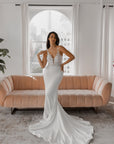 Camille Gown fitted crepe wedding dress with plunging V-neckline, floral lace illusion bodice and delicate lace straps.