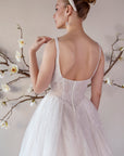 Back bodice detail of the Elara lace A-line wedding dress with a low scoop back and covered buttons