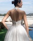 Back bodice detail of the Evangeline wedding dress with a detachable lace halter topper and low back