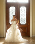 Full front view of the Sovereign organza ball gown with a structured strapless bodice and sweeping train