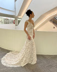 Amélie fitted lace wedding dress with cap sleeves, V-neckline and romantic chapel-length lace train.