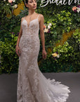 Front view of the Amélie Gown, a fitted lace wedding dress with spaghetti straps, plunging V-neckline and floral lace appliqué.