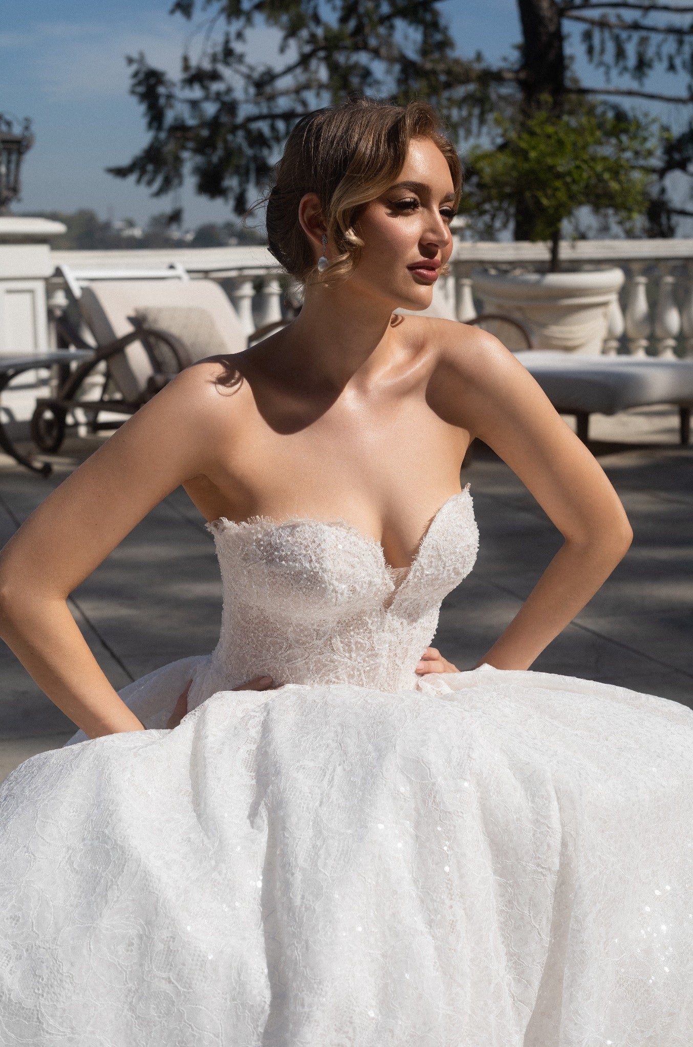 Close-up of the Aurelia beaded French lace ball gown with a plunging sweetheart neckline and structured corset bodice