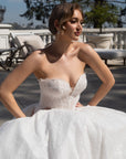 Close-up of the Aurelia beaded French lace ball gown with a plunging sweetheart neckline and structured corset bodice
