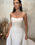Close-up of the Aveline fitted strapless wedding dress with dimensional floral lace appliqué