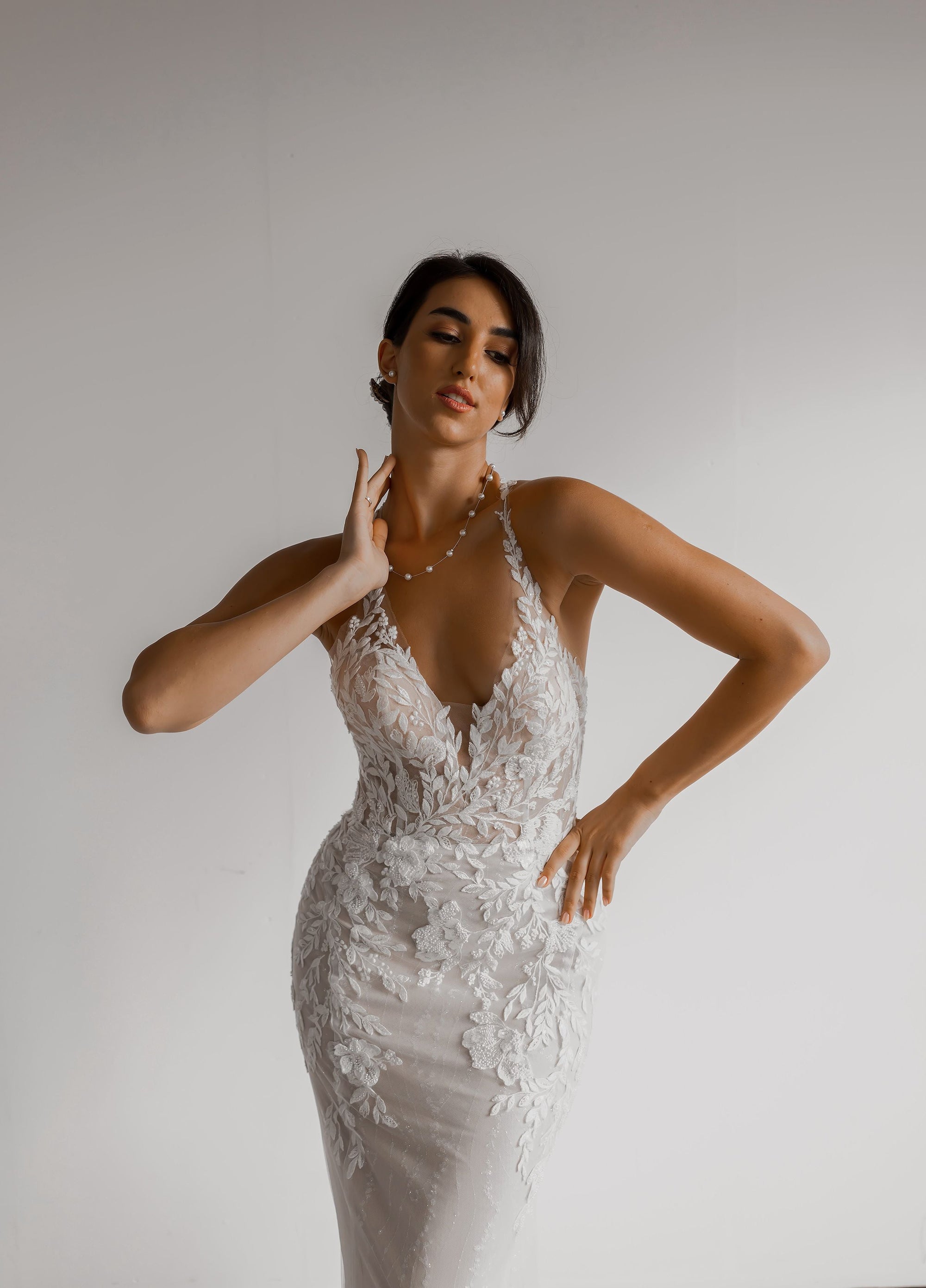 Aveline wedding dress with plunging V-neckline and floral lace appliqué bodice