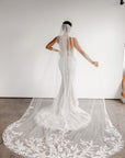 Aveline fitted lace wedding gown with cathedral veil and lace train at Swan Bridal