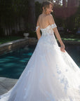 Three-quarter back view of the Elaria 3D floral lace ball gown with an off-shoulder neckline and sweeping train