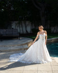 Front view of the Elaria off-shoulder 3D lace ball gown with a basque waist, full skirt, and flowing train