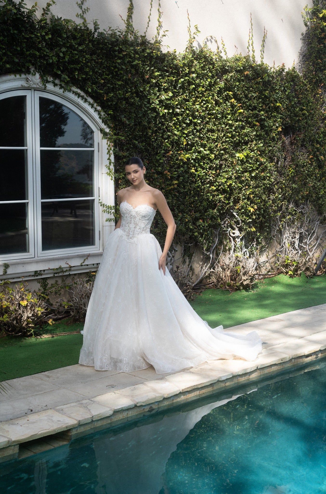 Front view of the Evangeline strapless lace A-line wedding dress without the detachable topper