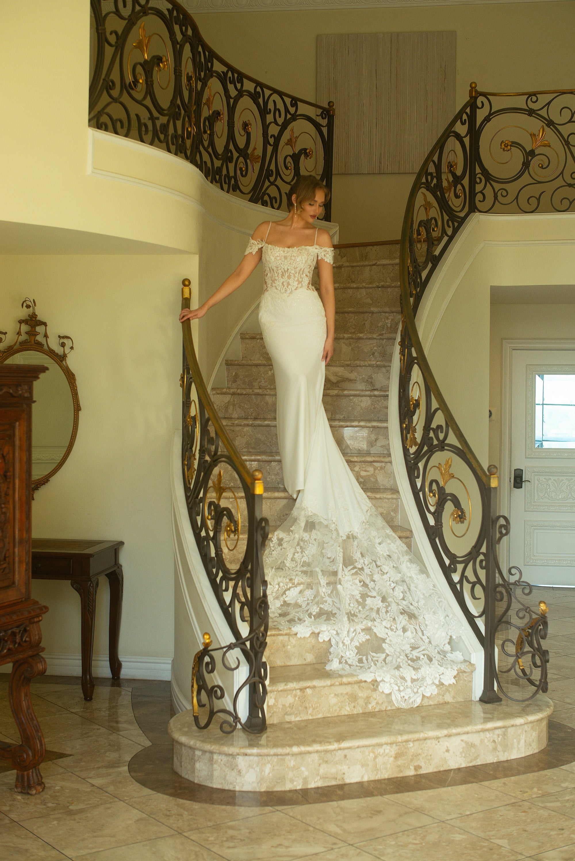 Front view of the Giardino fitted crepe wedding dress with a basque waist, beaded spaghetti straps, and off-the-shoulder lace sleeves