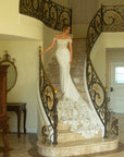 Front view of the Giardino fitted crepe wedding dress with a basque waist, beaded spaghetti straps, and off-the-shoulder lace sleeves