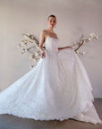 The Isolde strapless lace ball gown in motion, showing its full skirt, basque waist, and dimensional lace texture