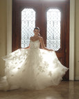 The Sovereign floral organza wedding dress shown in motion with a full appliquéd skirt