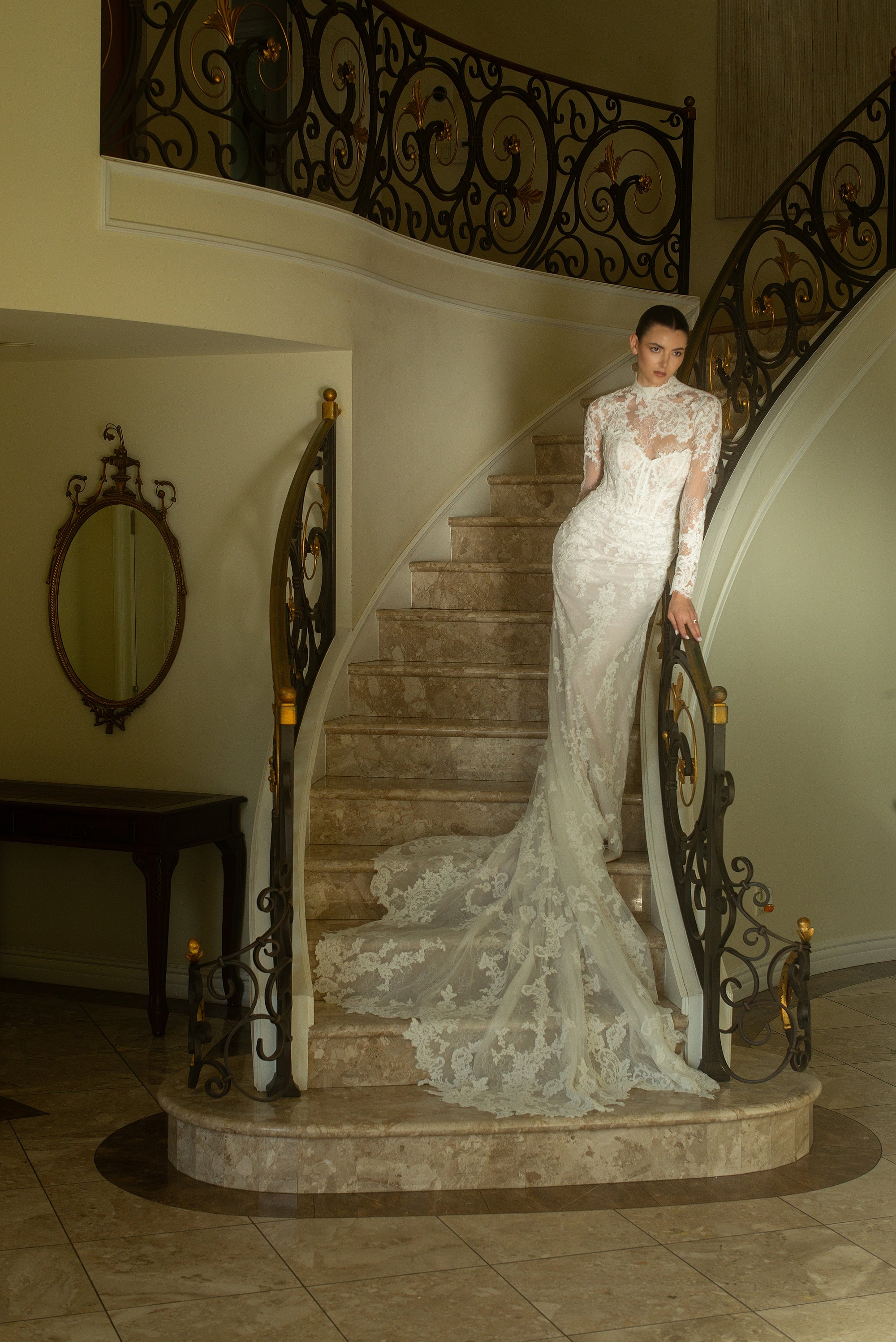 Front view of the Valentina fitted French lace wedding dress with a detachable high-neck illusion lace jacket