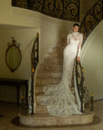 Front view of the Valentina fitted French lace wedding dress with a detachable high-neck illusion lace jacket